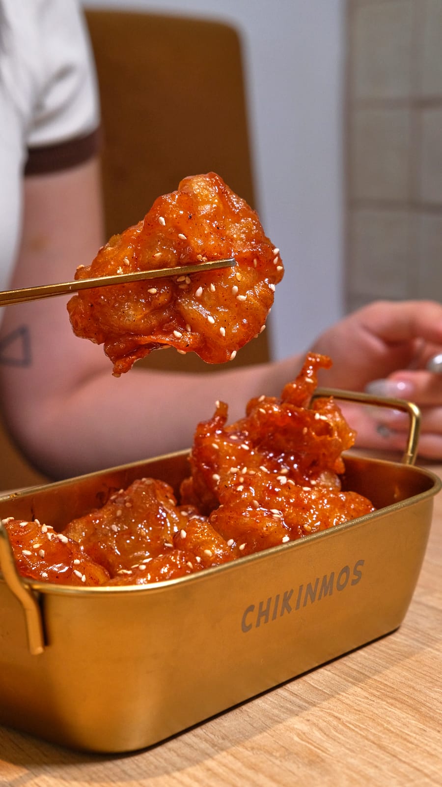 Chikinmos fried chicken in a branded tray